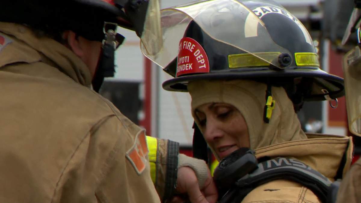 Calgary Mayor Jyoti Gondek is seen in full firefighter on May 30, 2022, as part of a firefighter training experience for city council.