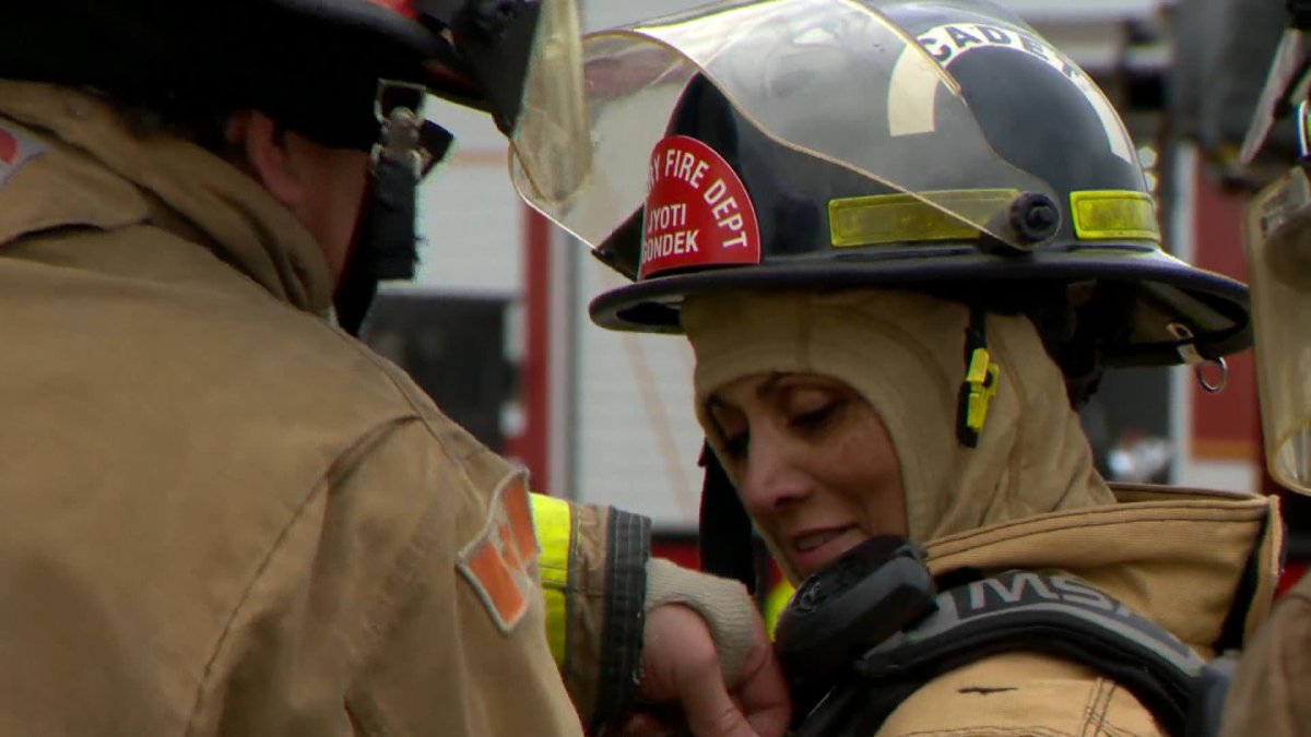 Calgary Mayor Jyoti Gondek is seen in full firefighter on May 30, 2022, as part of a firefighter training experience for city council.