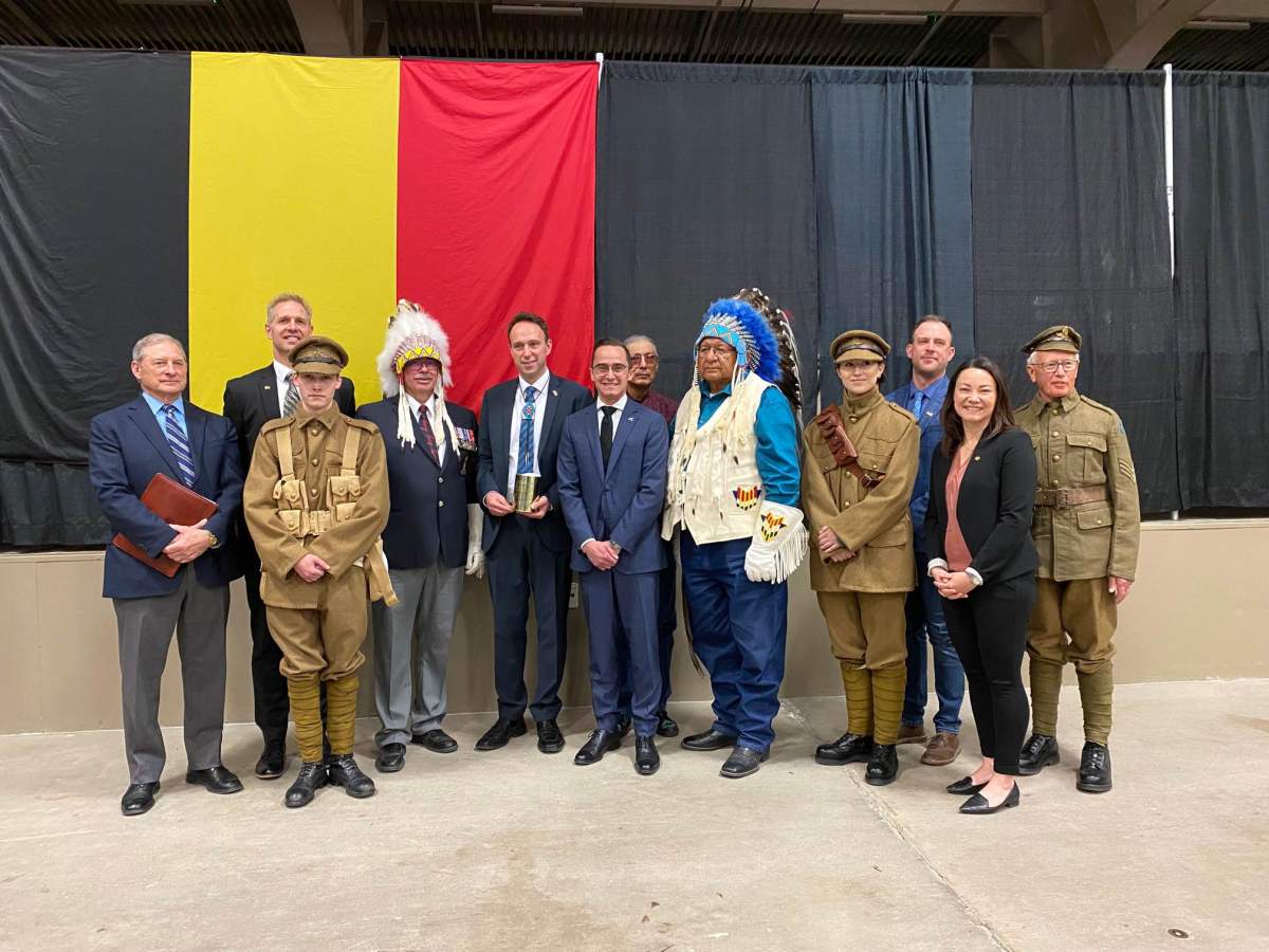 Dignitaries pose with Ambassador Patrick Van Gheel. May 7, 2022.