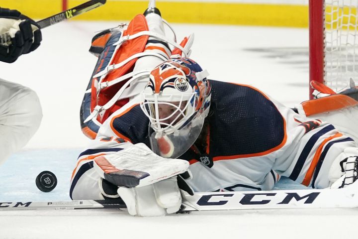 Edmonton Oilers goaltender Mike Smith stops a shot during the second period in Game 3 of an NHL hockey Stanley Cup first-round playoff series against the Los Angeles Kings Friday, May 6, 2022, in Los Angeles.