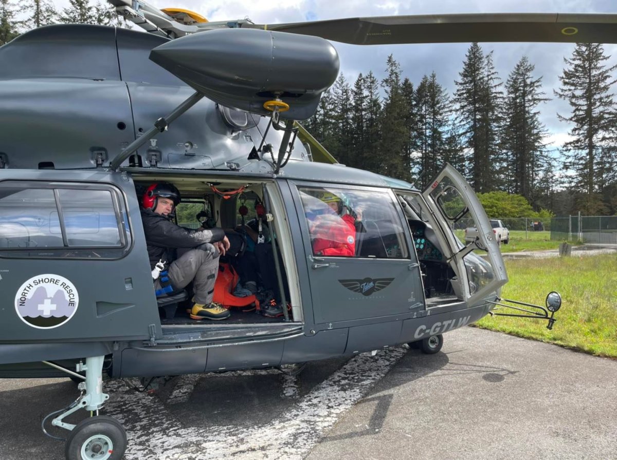North Shore Rescue volunteers board a helicopter to attempt a rescue on the Howe Sound Crest trail on Friday. 