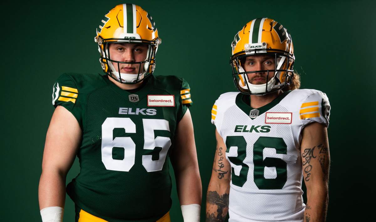 Edmonton Elks players in the team's new jerseys