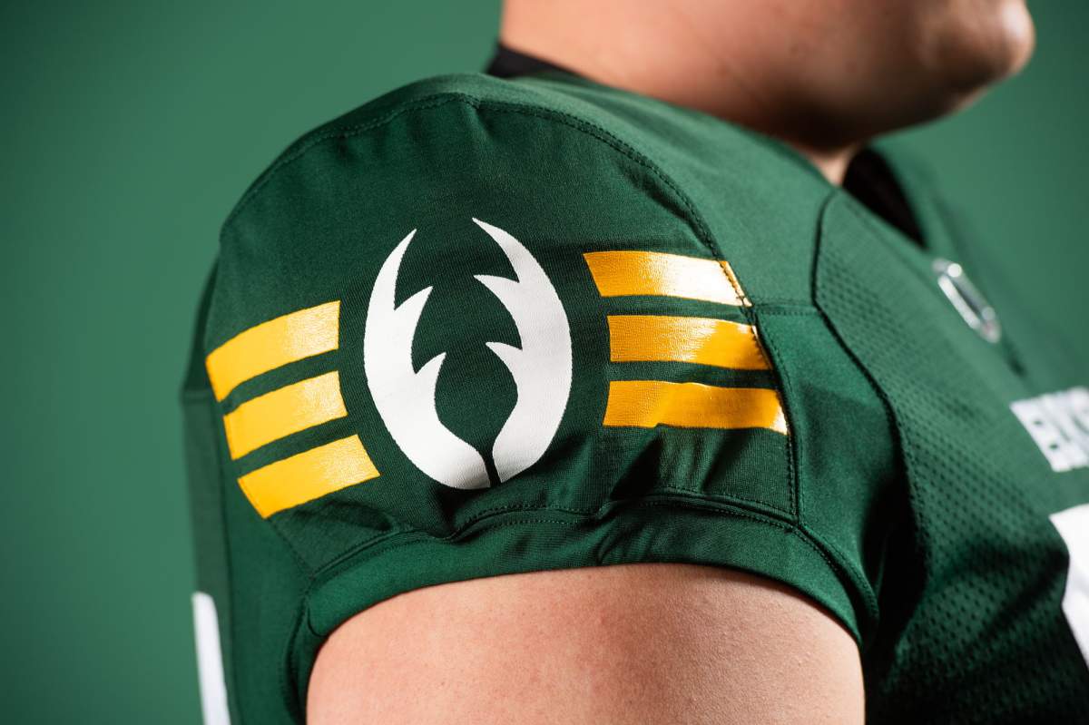 Edmonton Elks players in the team's new jerseys