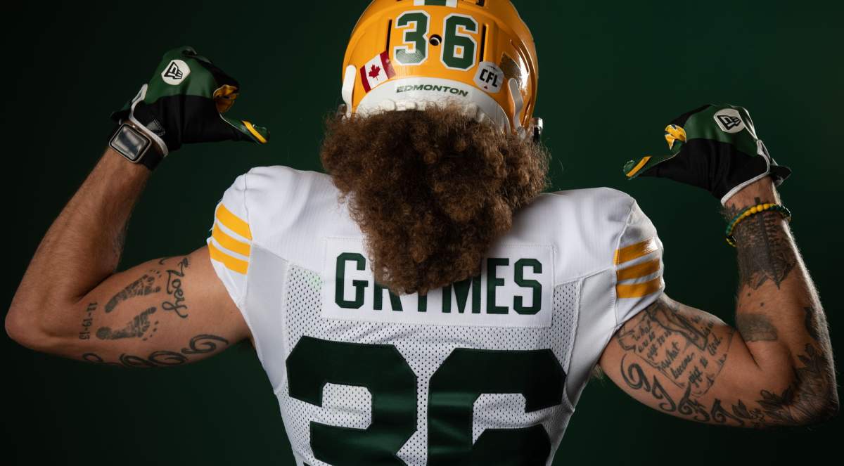 Edmonton Elks players in the team's new jerseys