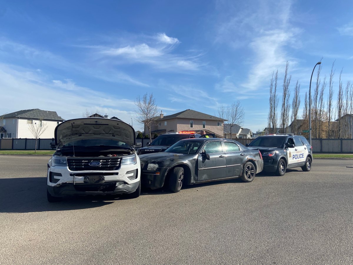 A northeast Edmonton intersection remained closed Monday evening as police continued an investigation into a weapons complaint that also appeared to result in a collision involving a police vehicle.