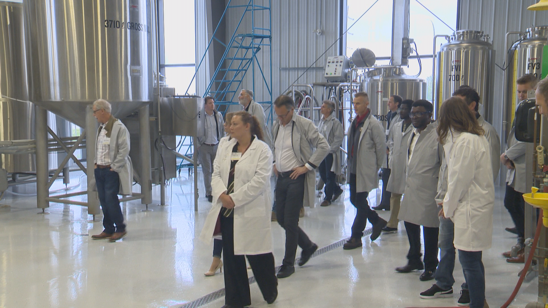 Guests tour the new PIP International Inc. facility in Lethbridge on May 30, 2022.