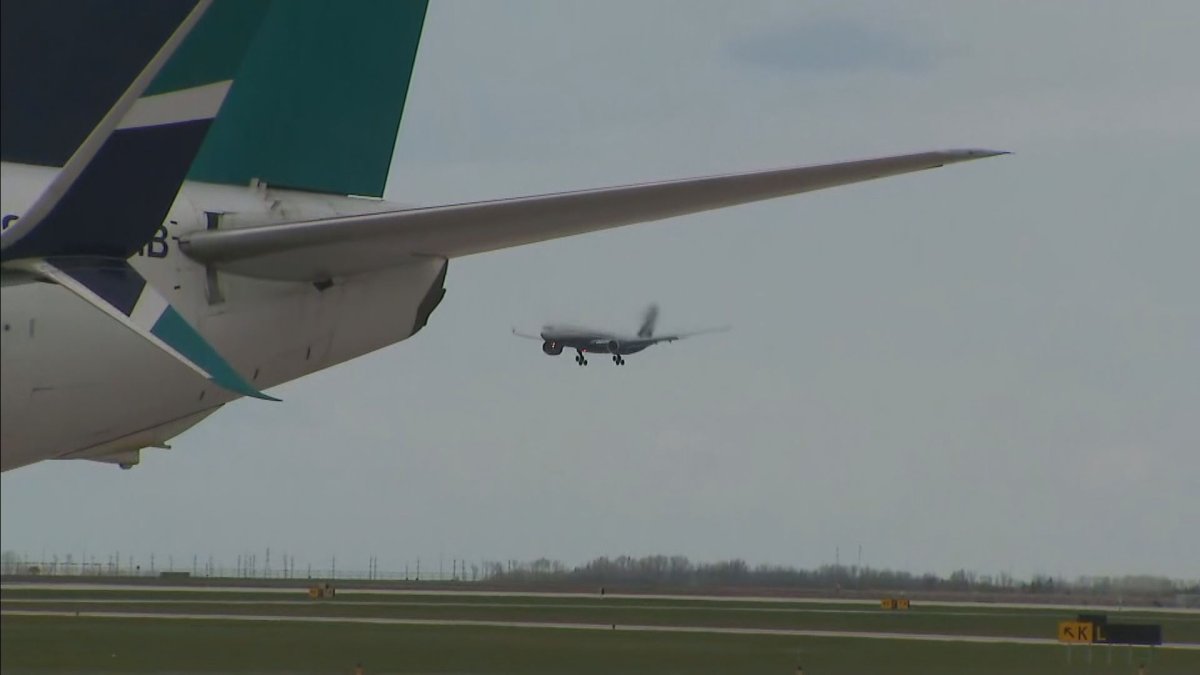 The first of three planes carrying Ukrainian refugees arriving in Winnipeg on Monday afternoon.