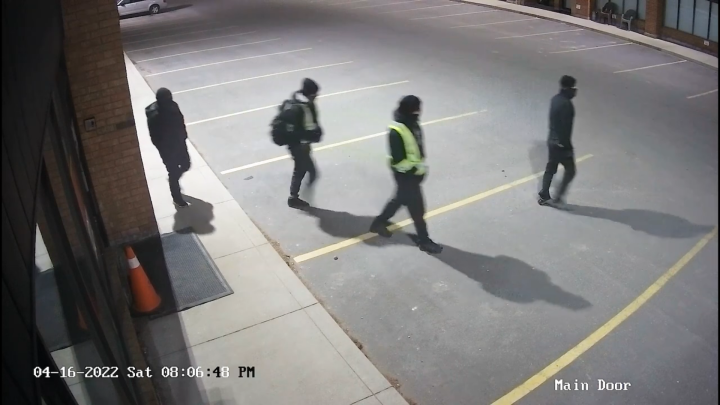 A screenshot of a surveillance video showing suspects.