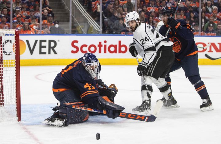 Los Angeles Kings’ Phillip Danault (24) is stopped by Edmonton Oilers’ goalie Mike Smith (41) as Duncan Keith (2) defends during first period NHL playoff action in Edmonton on Wednesday, May 4, 2022.