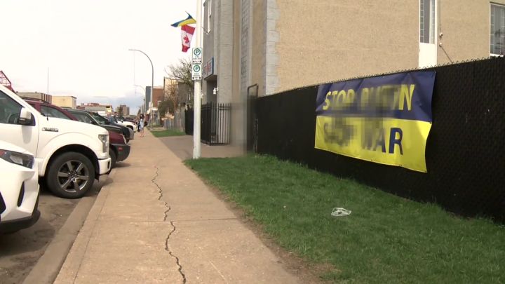 On Friday, swastikas were found spraypainted on Edmonton’s Ukrainian National Federation Hall as well as on a “Stop Putin, Stop War” banner hanging just next to the building. Global News has decided to blur the swastika images.