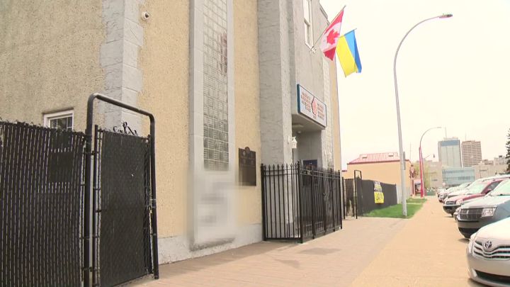 On Friday, swastikas were found spraypainted on Edmonton's Ukrainian National Federation Hall as well as on a "Stop Putin, Stop War" banner hanging just next to the building. Global News has decided to blur the swastika images.