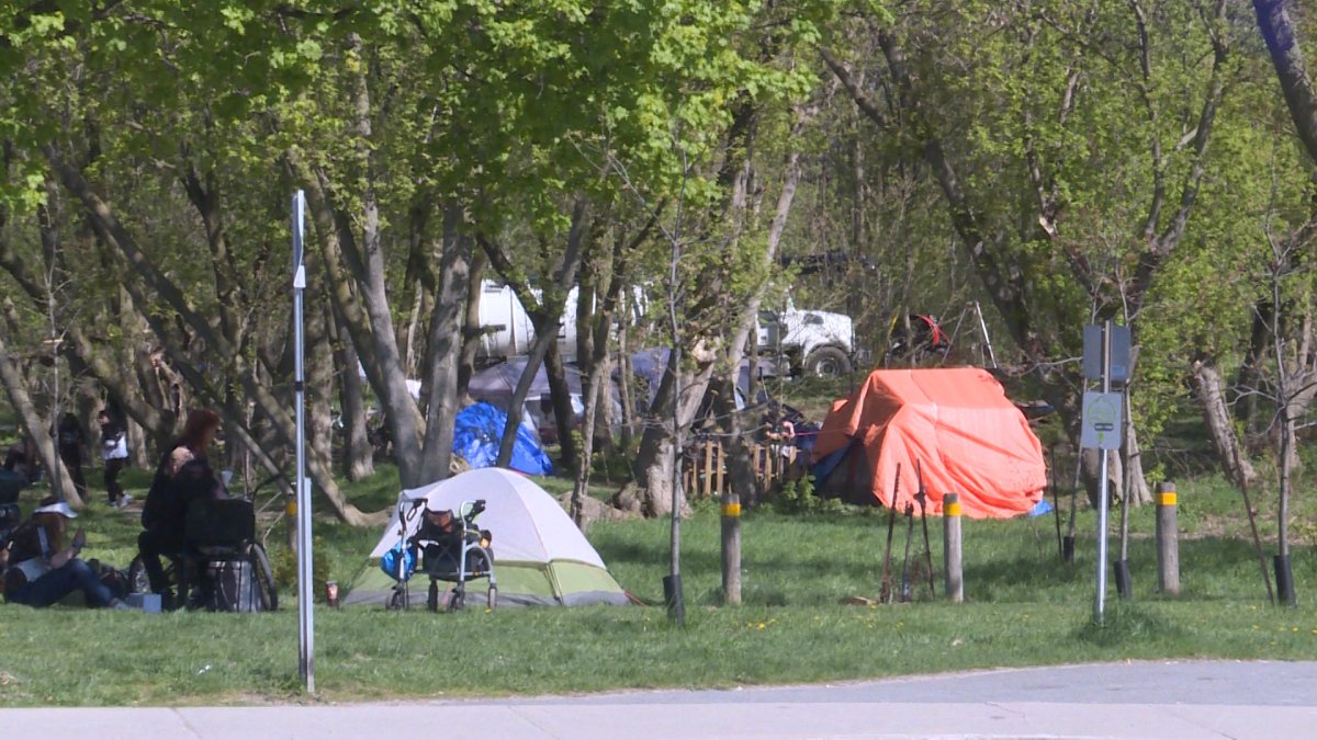 Pitched tents homeless individuals live in near the Integrated Care Hub