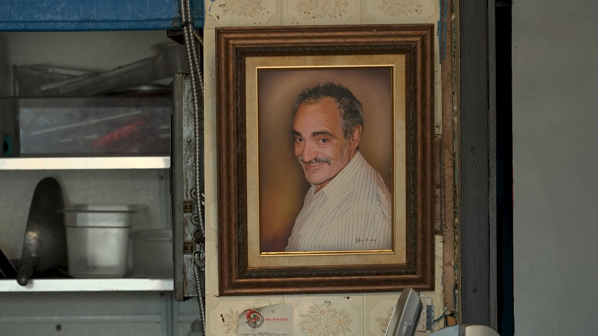 A framed photo of the late Cosmo’s owner, Tony Koulakis, hangs in the back of the diner