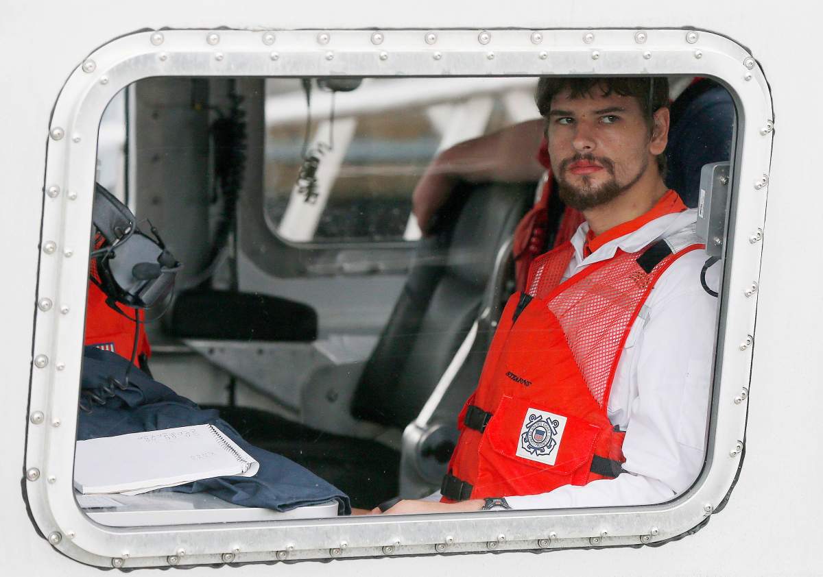 FILE- In this Sept. 27, 2016, file photo, Nathan Carman arrives in a small boat at the US Coast Guard station in Boston.