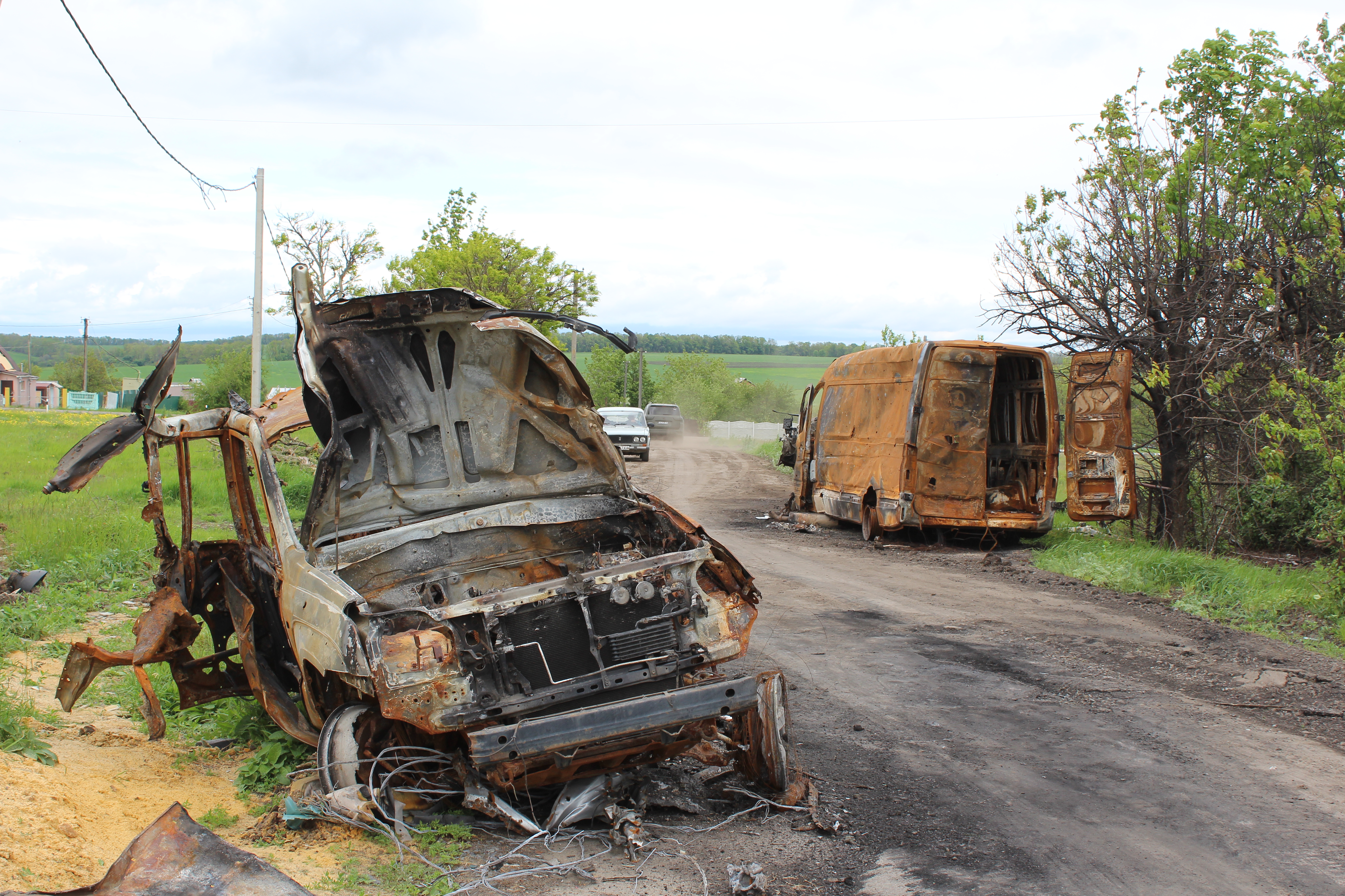 Vehicles on Ukrainian Street, Vilkhivka, Ukraine, May 21, 2022.