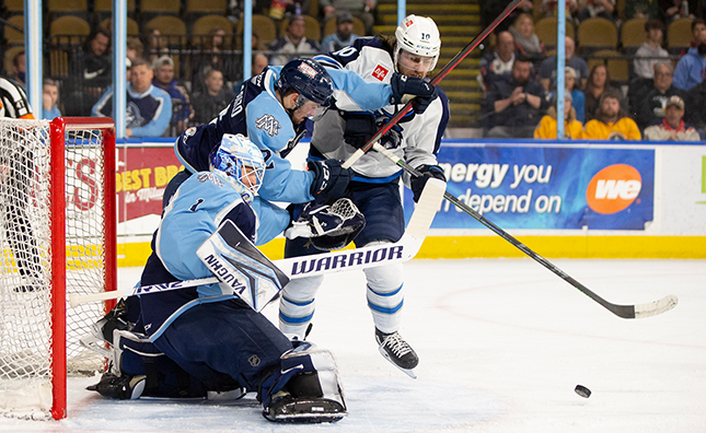 Manitoba Moose forward Evan Polei battling in front of the net during game one of the AHL central division semi-final series in Milwaukee. 