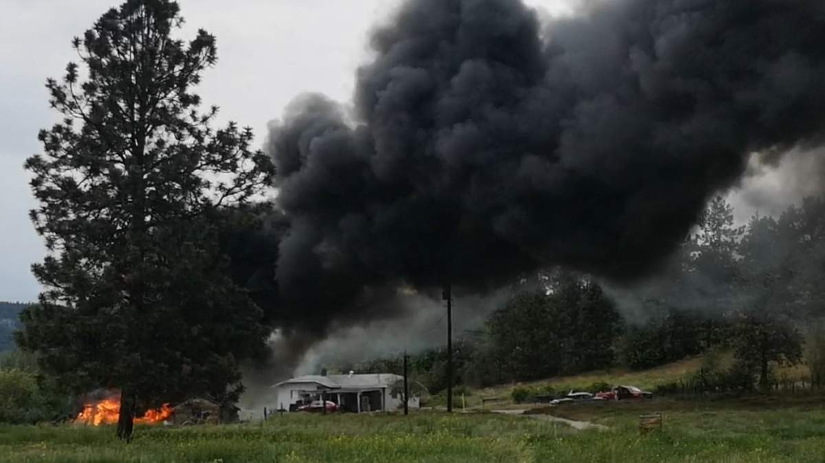 Thick smoke rises from an outbuilding that was on fire on Tuesday afternoon in West Kelowna.