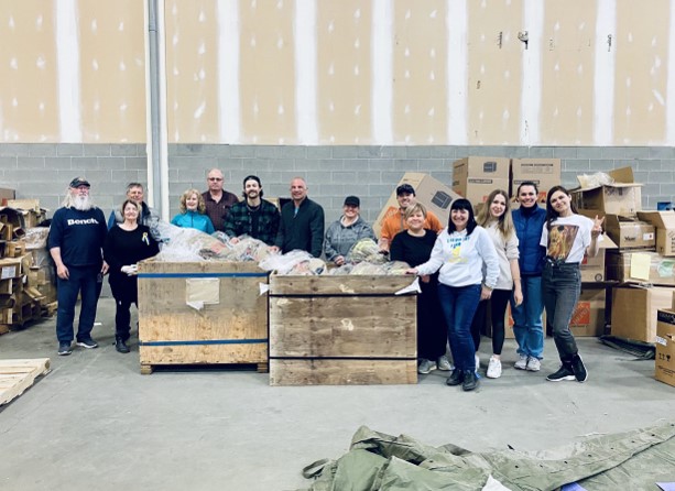 Firefighter Bo Kutsiuruba, sixth from left, with volunteers with Firefighter Aid Ukraine		.