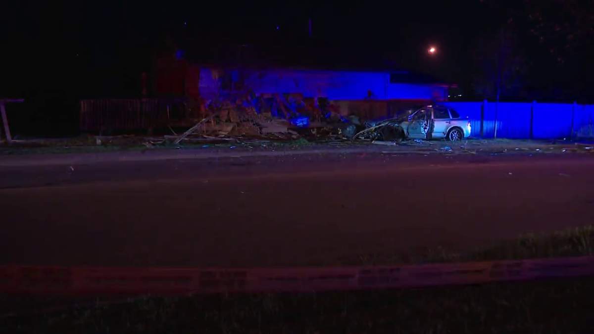 Police investigate after a car crashed into the side of a home along Silver Berry Road between 29 Street and 28A Avenue in southeast Edmonton Thursday, May 26, 2022.