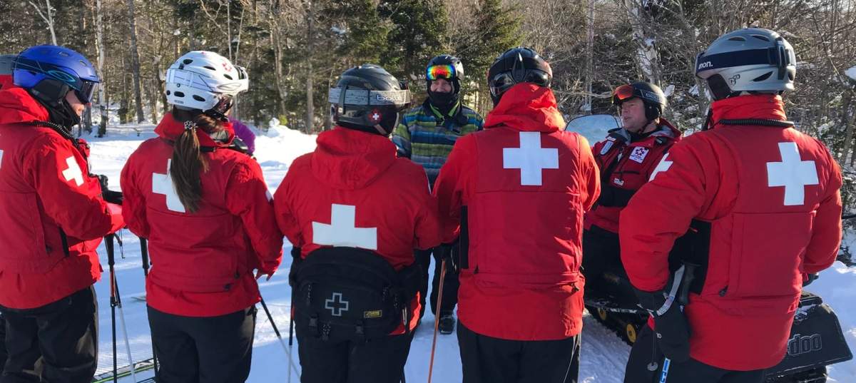 Doug Maclean taking part in a ski patrol exercise.