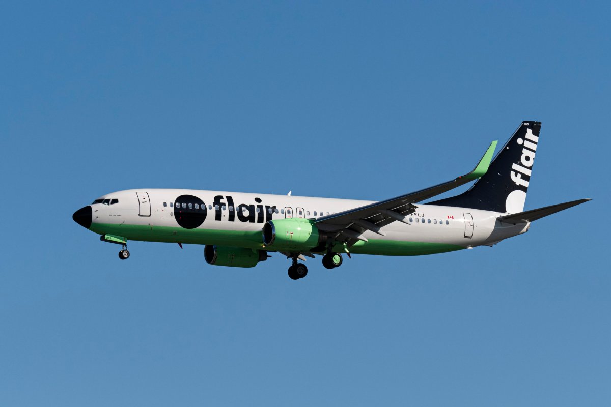 A Flair Airlines Boeing 737-800 (C-FFLJ) single-aisle jetliner, painted in the airlines new-look livery, on short final approach for landing at Vancouver International Airport, Richmond, B.C. on Monday, September 30, 2019. 
