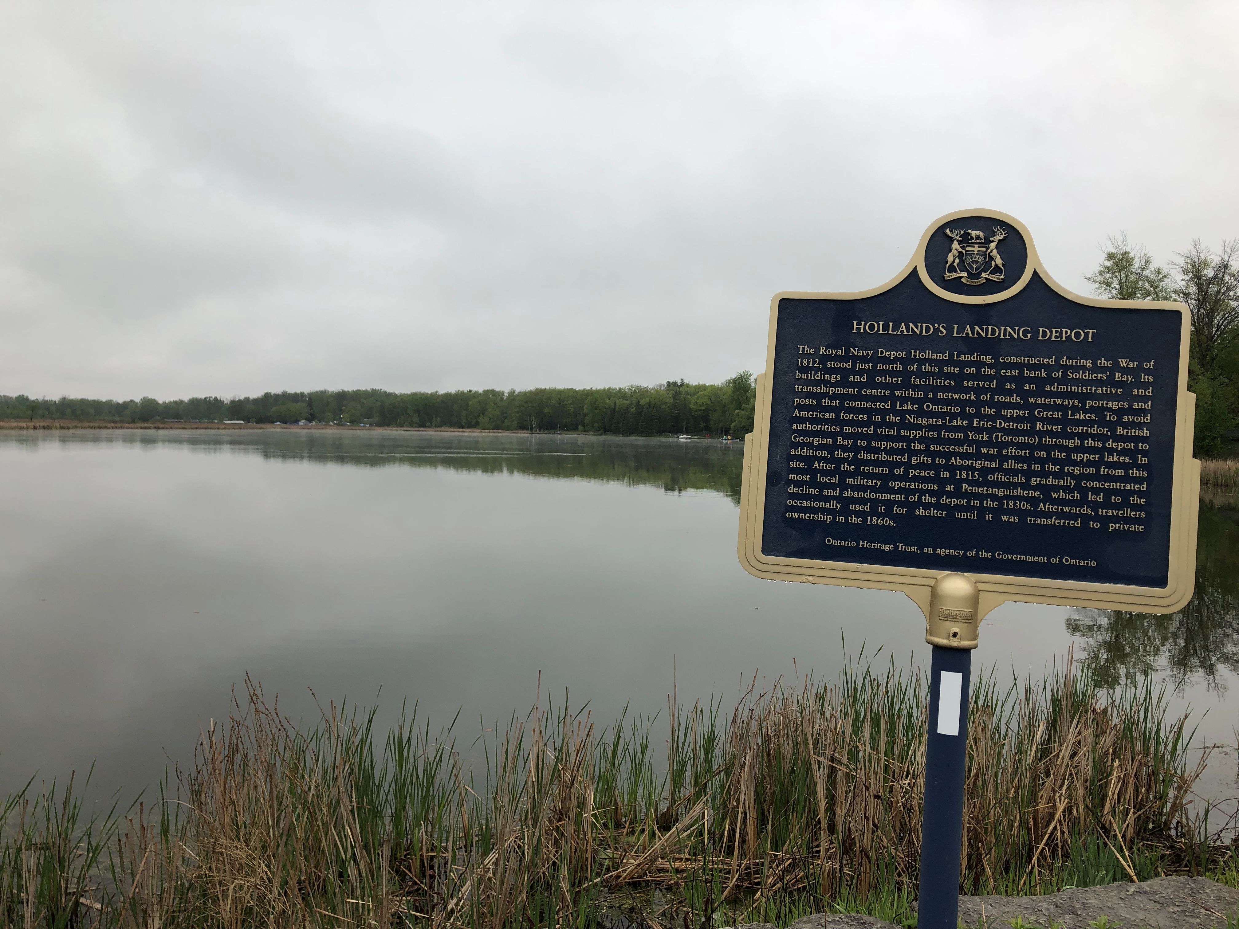 A sign describes the historical significance of the Holland Landing, a naval depot during the War of 1812