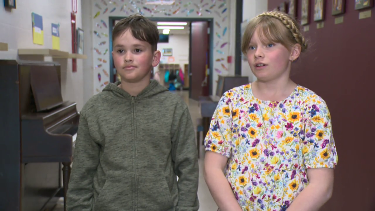 Solomiya Marcinkoski (R) is a Grade 4 student a the school. She and her family welcomed her cousin Kostia Radchenko (L) into their home.