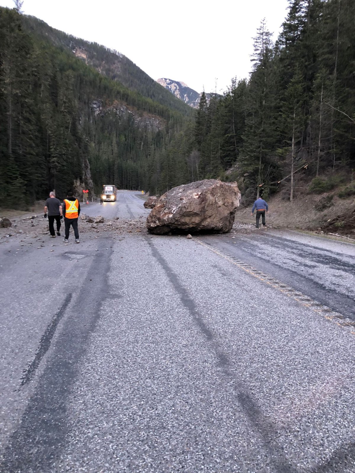 A boulder is blocking the highway seven kilometres north of Radium Hot Springs.