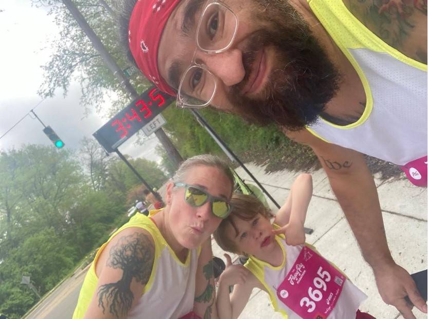 Ben and Kami Crawford are pictured with their son, Rainier, during the Flying Pigs Marathon.