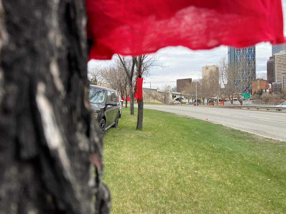 Red dresses hung along Memorial drive.