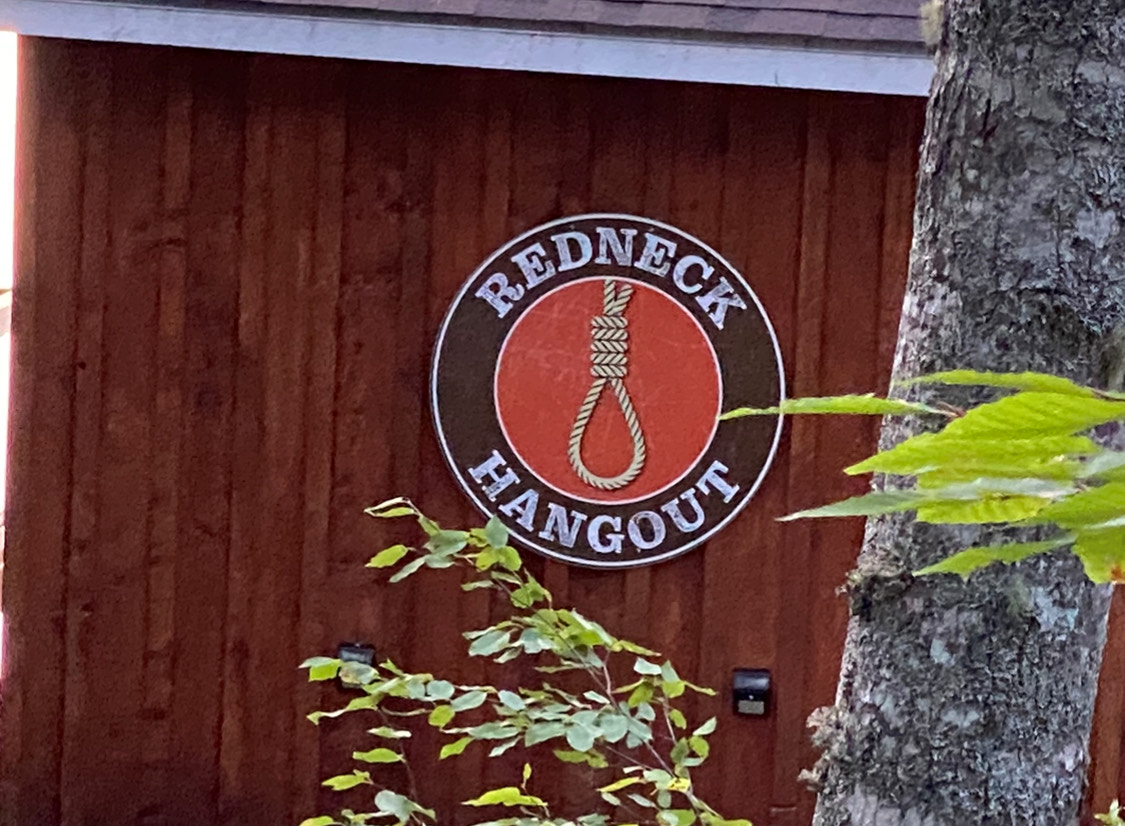 The sign affixed to the cabin featured an image of a noose and the words ‘Redneck Hangout.’