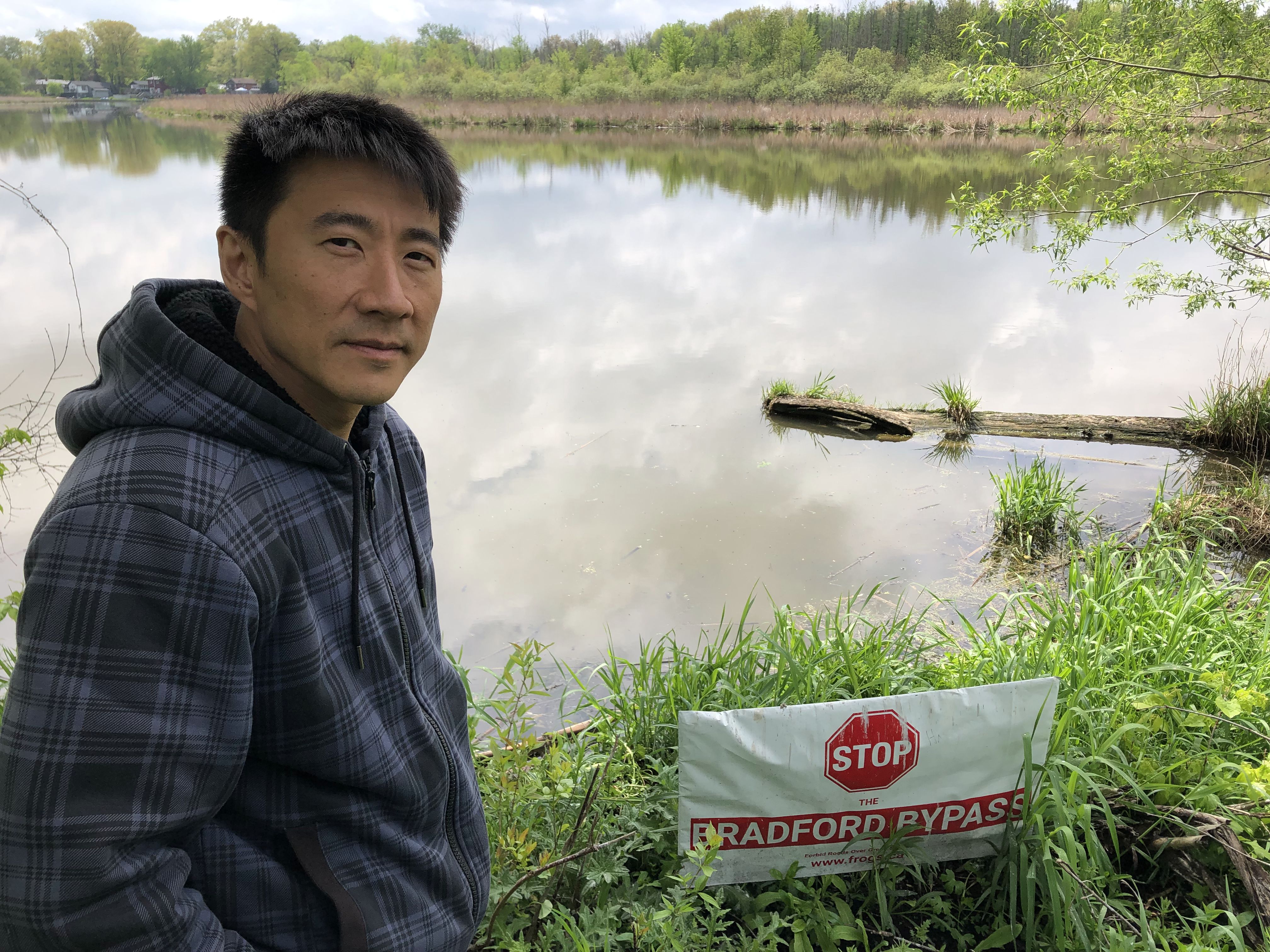 East Gwillimbury, Ont. resident Thomas To on the Holland River, next to his secluded, wooded property that would be destroyed if the Bradford Bypass is built.