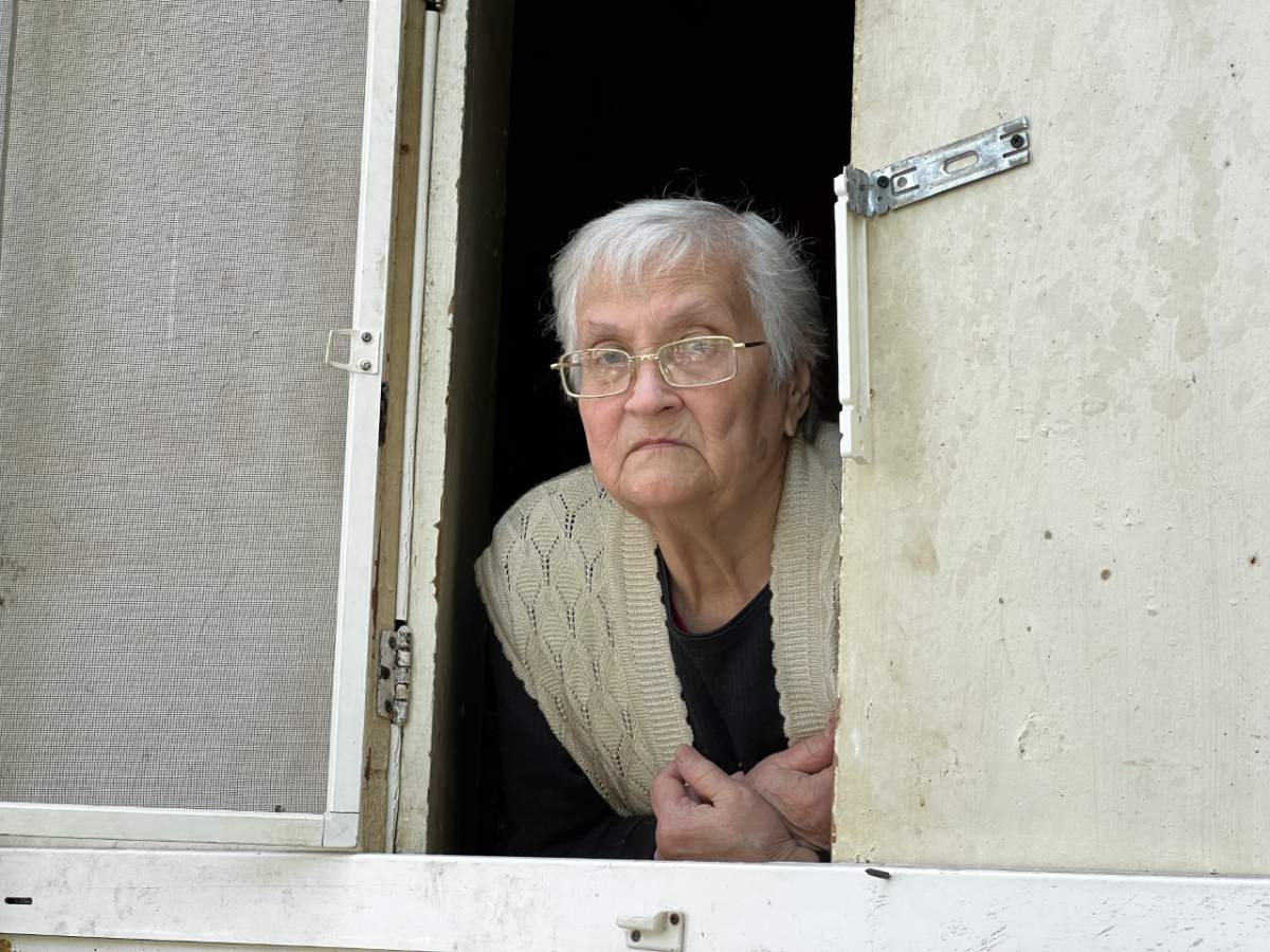 Albina Vonomarova n window of her apartment, which was bombed by Russia, May 30, 2022.