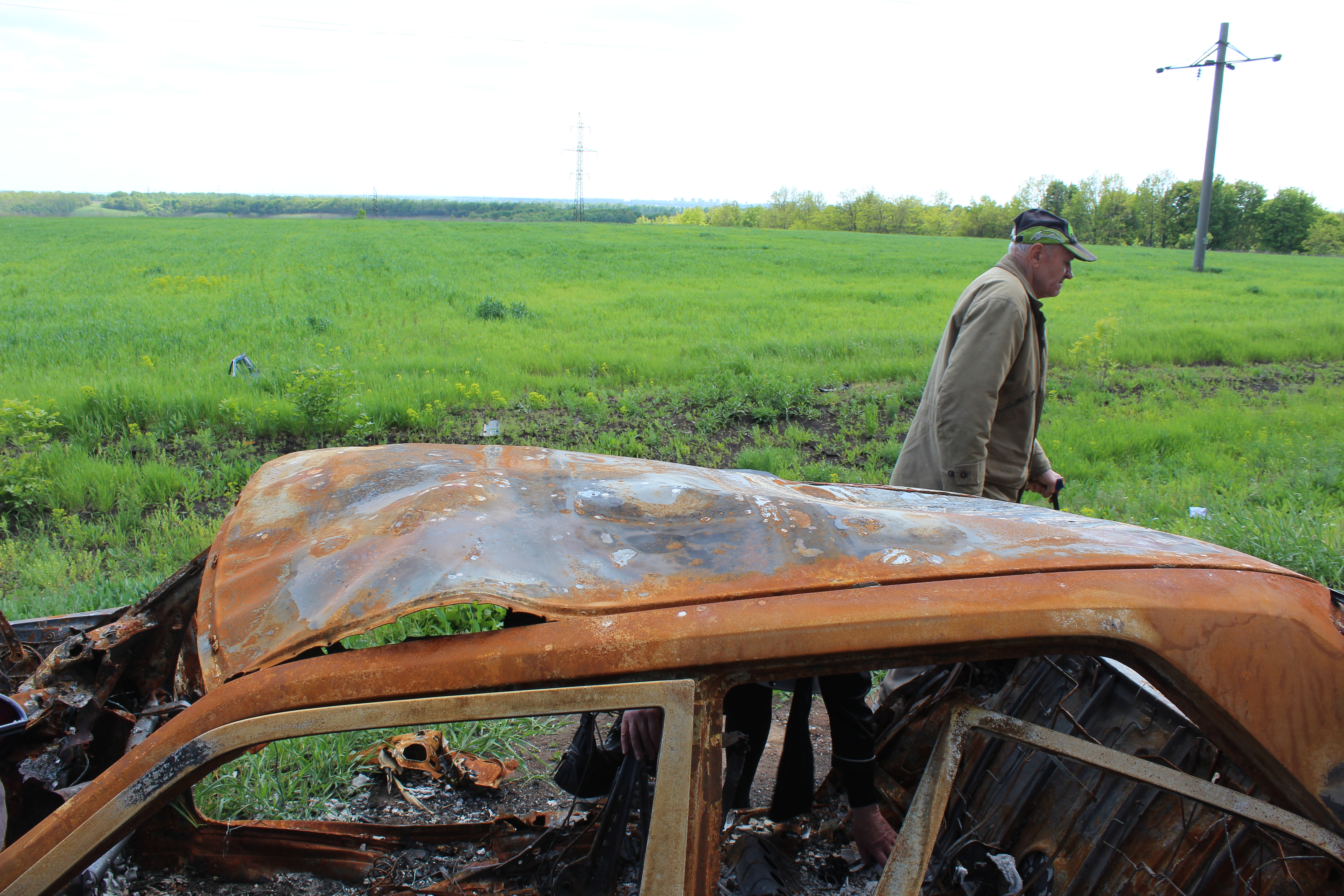 The father of a man killed by a Russian tank leaves the scene where it happened near Vilkhivka, Ukraine. May 23, 2022.