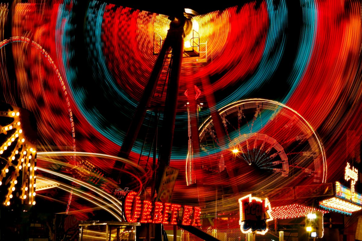 Midway rides light up the night sky of the Western Fair in London, Ont., Sunday, Sept. 16, 2007.