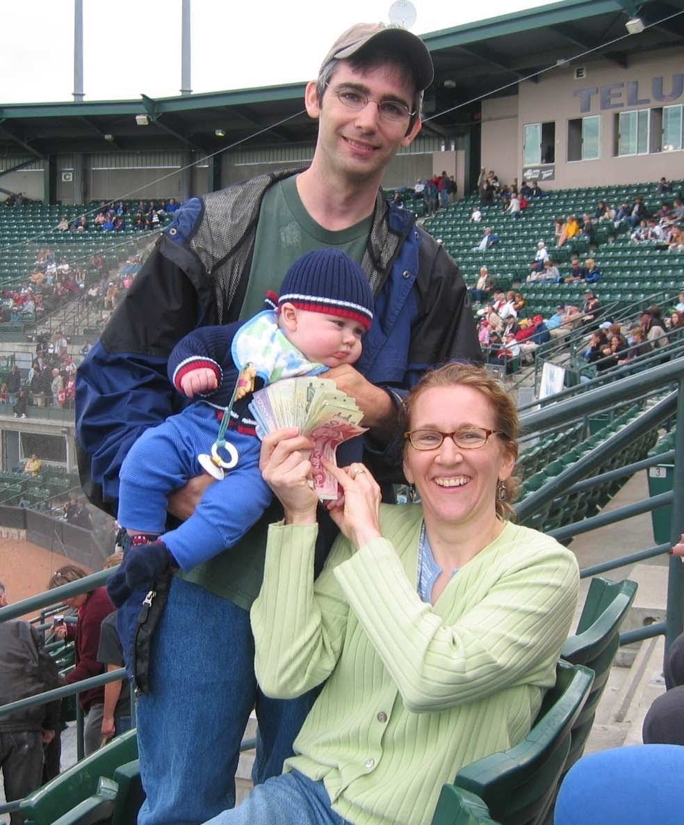 The Bruces pose with the winnings from a 50/50 draw they never bought a ticket for.