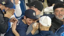 A young Yankees fan cries after getting the home run ball