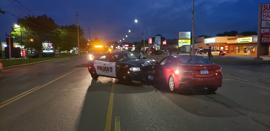 The driver turned west onto London Road in Sarnia, Ont., and began to drift across lanes of traffic, striking a different police cruiser that was stopped in the middle of the road.