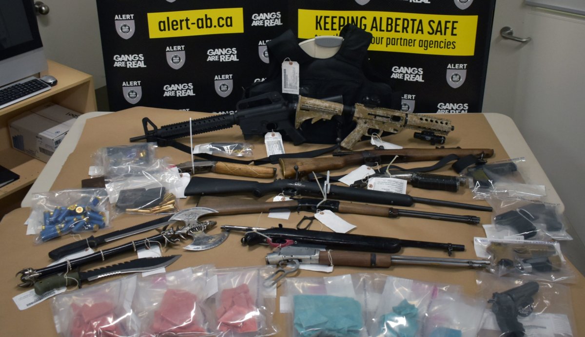 A picture of the suspected fentanyl powder and firearms seized by the Alberta Law Enforcement Response Team in Red Deer on June 3.