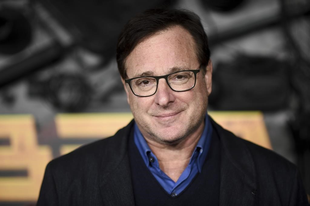 Bob Saget arrives at a screening of "MacGruber" on Dec. 8, 2021, in Los Angeles. Saget's family has released a statement on the cause of his death last month in Florida, citing authorities saying the actor-comedian died from an accidental blow to the head.