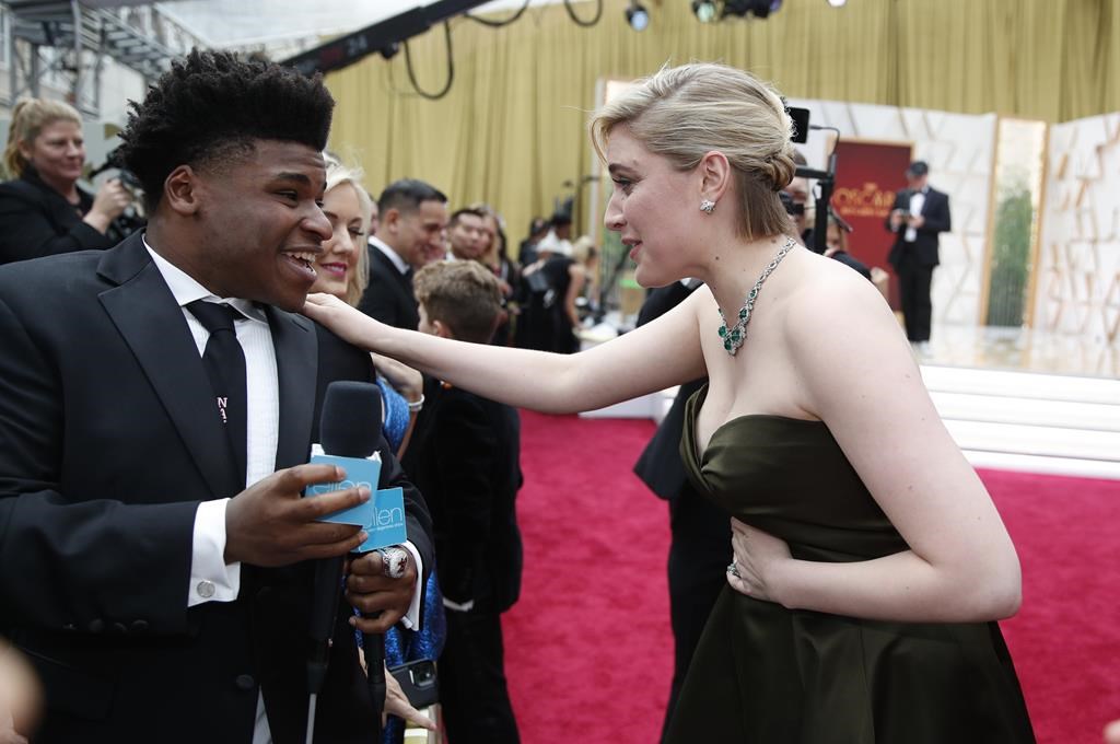 Greta Gerwig, right, talks to Jerry Harris on the red carpet at the Oscars at the Dolby Theatre in Los Angeles, Feb. 9, 2020. Former “Cheer” star Jerry Harris has pleaded guilty to felony child pornography and child sex charges in federal court. The 22-year-old Harris entered his plea on Thursday, Feb. 10, 2022 to receiving child pornography and traveling with the intent to engage in illicit sexual conduct.