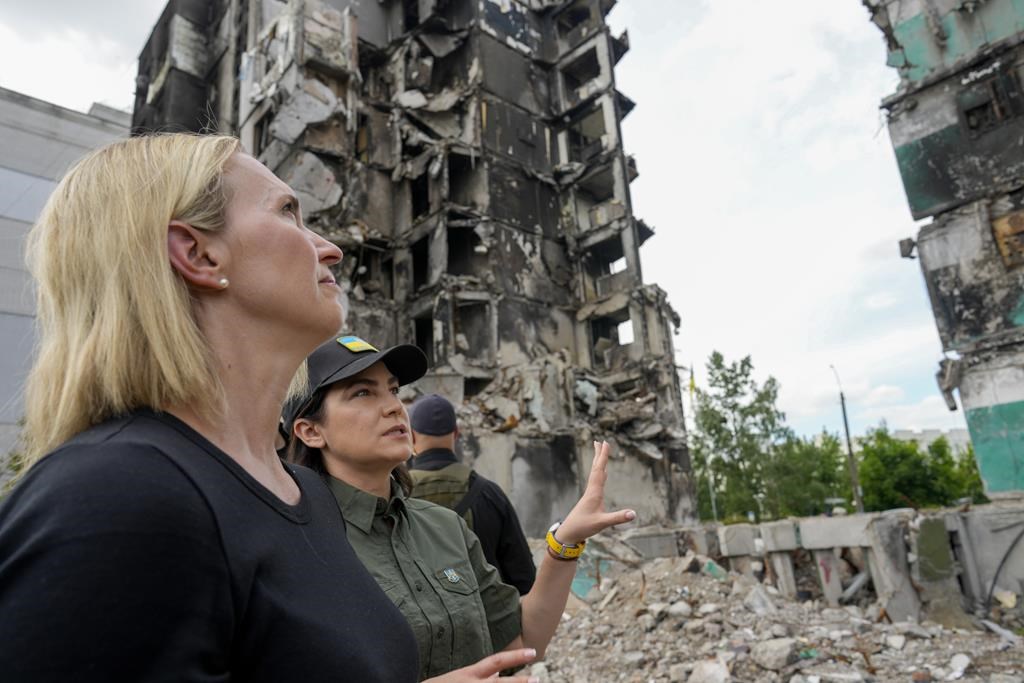 U.S. ambassador to Ukraine Bridget Brink, left, listens to Ukraine’s Prosecutor General Iryna Venediktov during a tour of a destroyed area in Borodyanka, outskirts of Kyiv, Ukraine, Saturday, June 4, 2022. (AP Photo/Natacha Pisarenko)