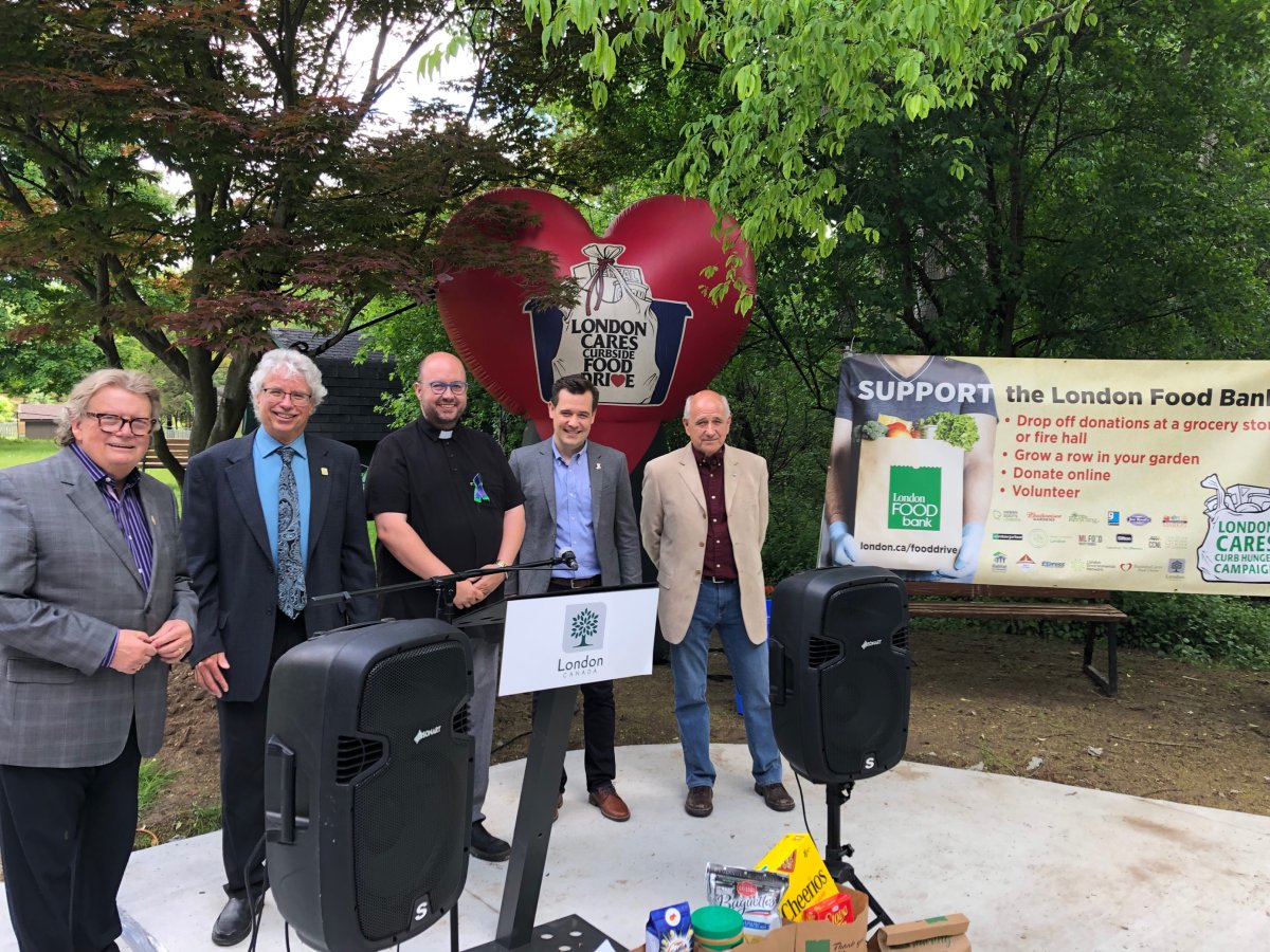 London Mayor Ed Holder; director of environmental, fleet and waste services Jay Stanford; Canon Kevin George; medical officer of health Dr. Alex Summers; and London Food Bank co-executive director Glen Pearson on June 8, 2022.