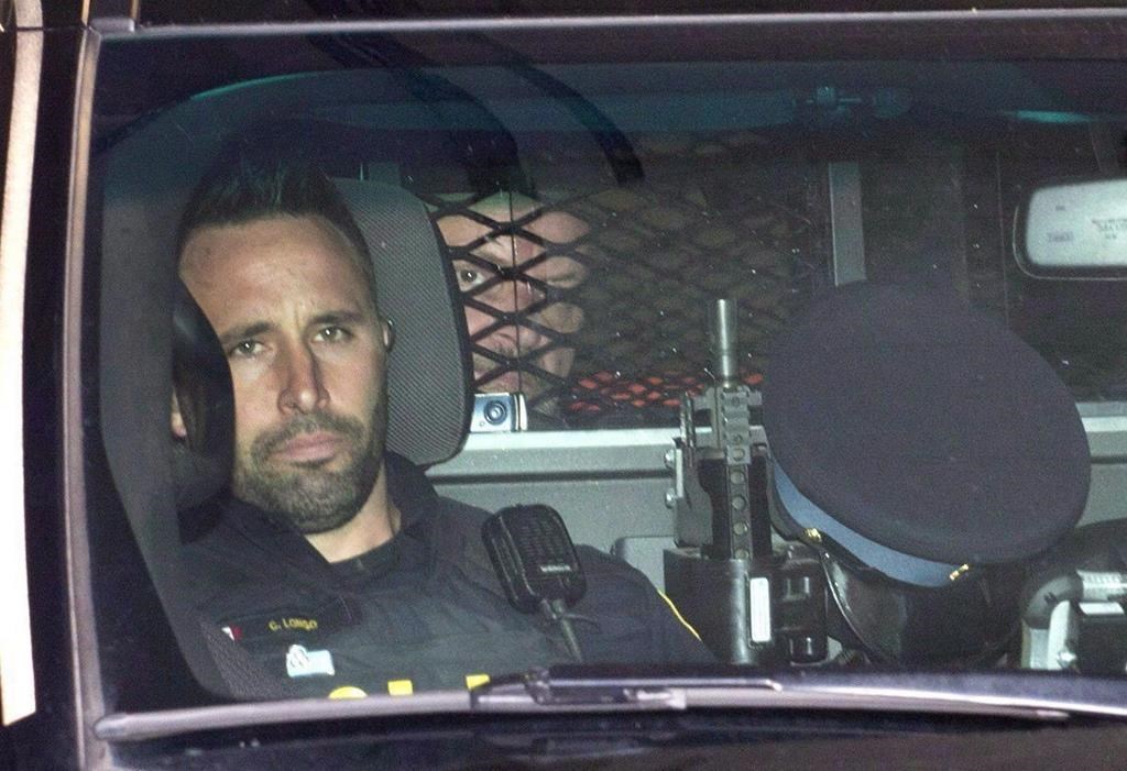 Basil Borutski leaves in a police vehicle after appearing at the courthouse in Pembroke, Ont. on Sept. 23, 2015. A coroner's inquest is hearing a review of how probation and parole officers in Ontario handled the file of Basil Borutski before he murdered three of his former partners in 2015. THE CANADIAN PRESS/Justin Tang.