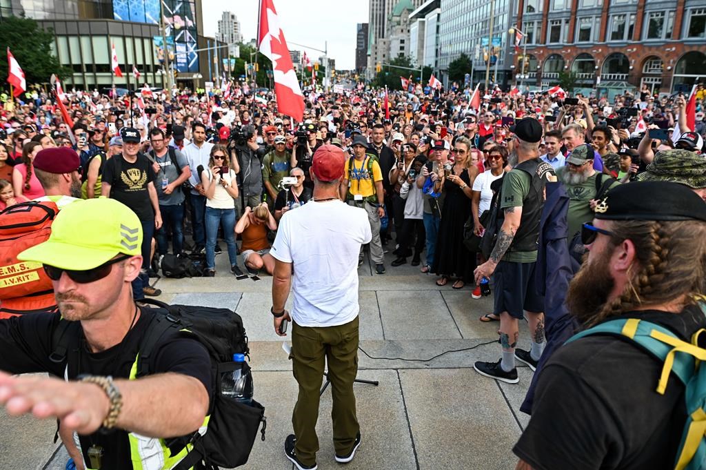 Army reservist James Topp speaks to the crowd during a protest against COVID-19 health measures at the National War Memorial in Ottawa, Ont. on Thursday, June 30, 2022. 