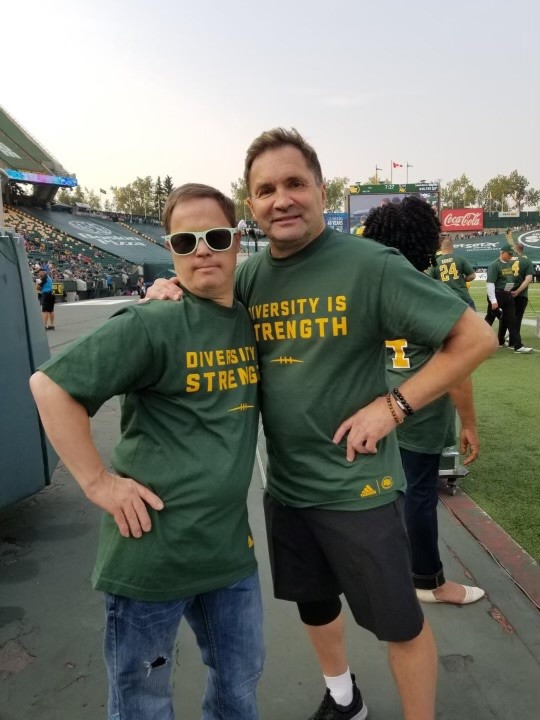 Dwayne Mandrusiak and Joey Moss pose with Diversity is Strength shirts