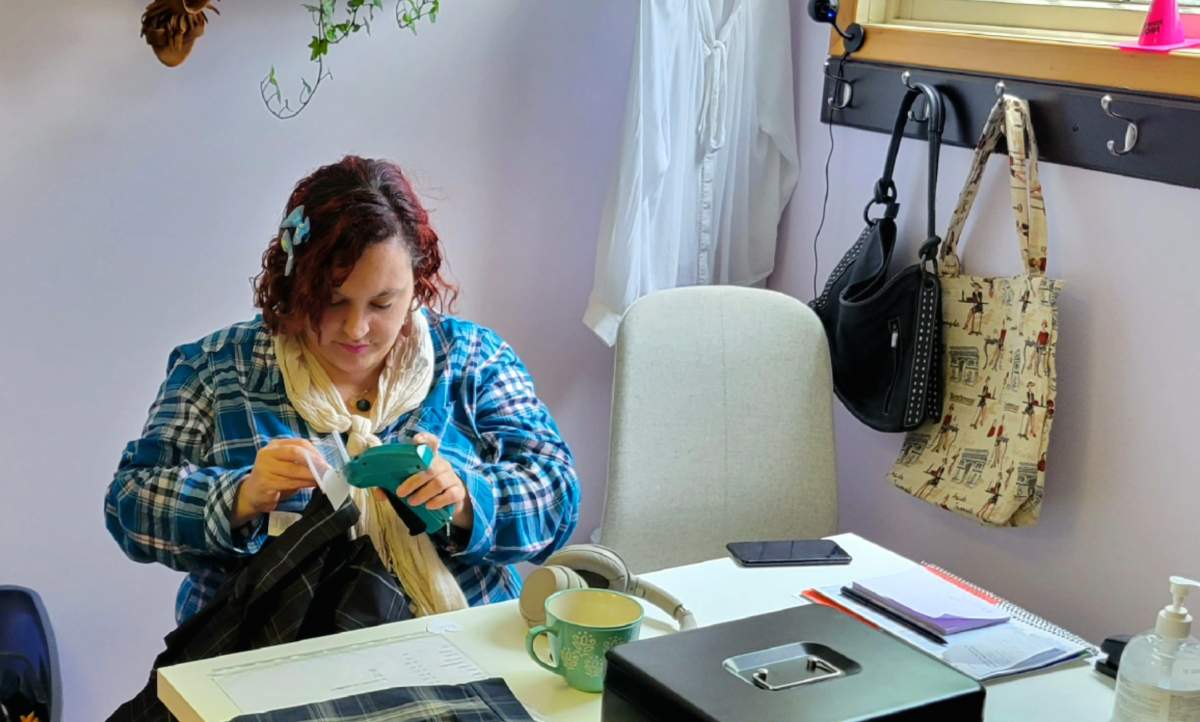 Shawnna Hastings-Downey works at The Abundance Store on Friday, June 3, 2022.