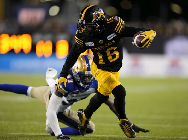 Hamilton Tiger-Cats wide receiver Brandon Banks (16) evades a tackle from Winnipeg Blue Bombers defensive back Brandon Alexander (37) during second half football action in the 108th CFL Grey Cup in Hamilton, Ont., on Sunday, December 12, 2021.