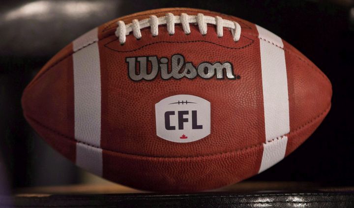 A football with the new CFL logo sits on a chair during a press conference in Winnipeg, Friday, November 27, 2015. 