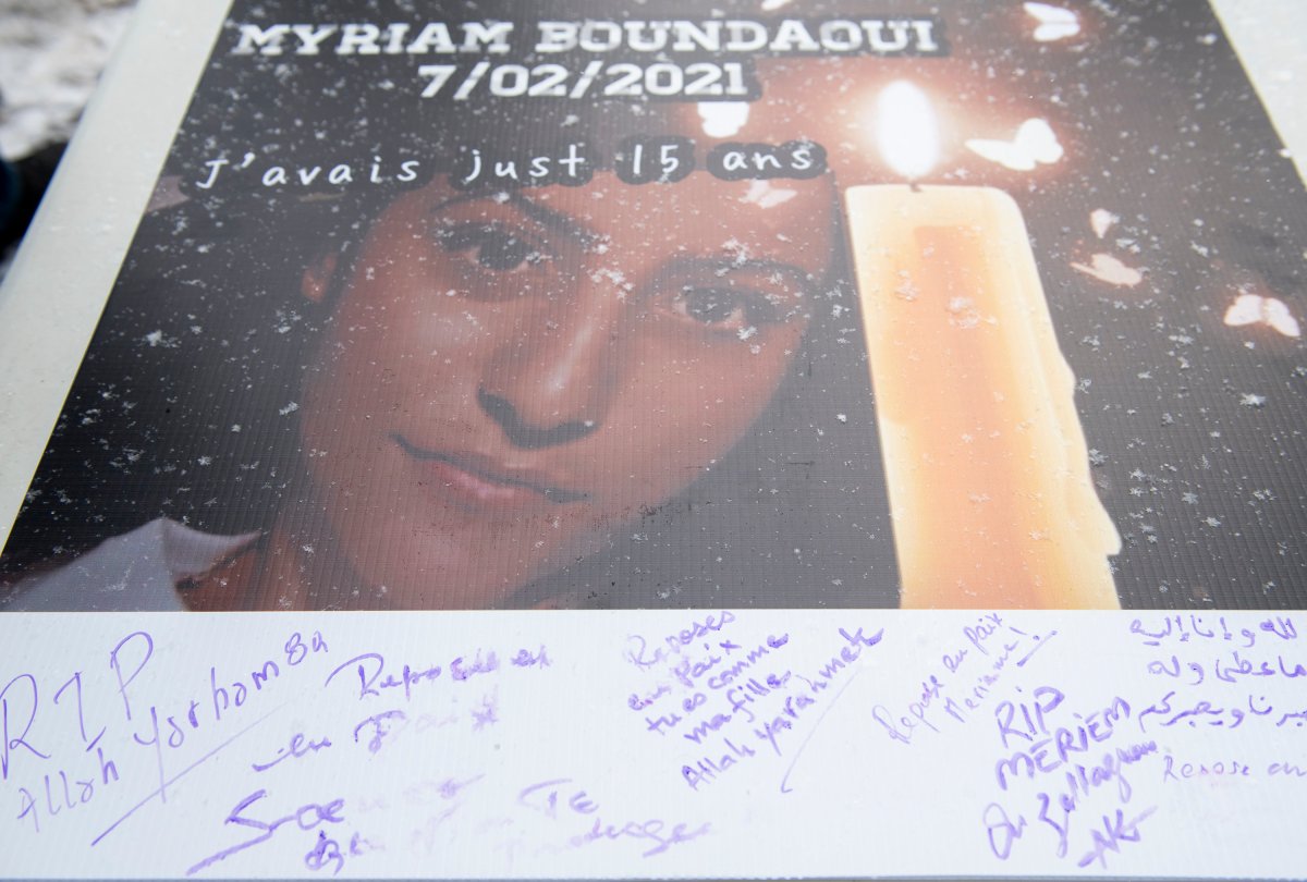 Messages are shown on a card during a vigil and protest against gun violence in memory of Meriem Boundaoui in Montreal, Sunday, Feb. 14, 2021. 
